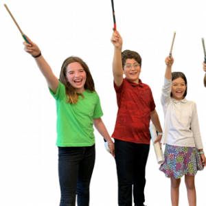 Three students smile as they wave wands