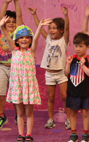 Students in a classroom playing.